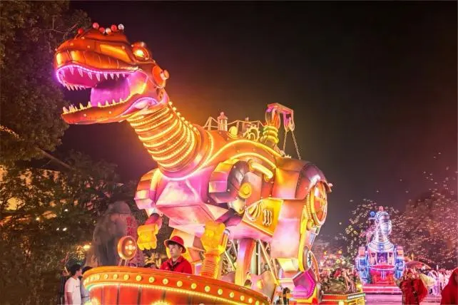 Large-scale animatronic parade float at night