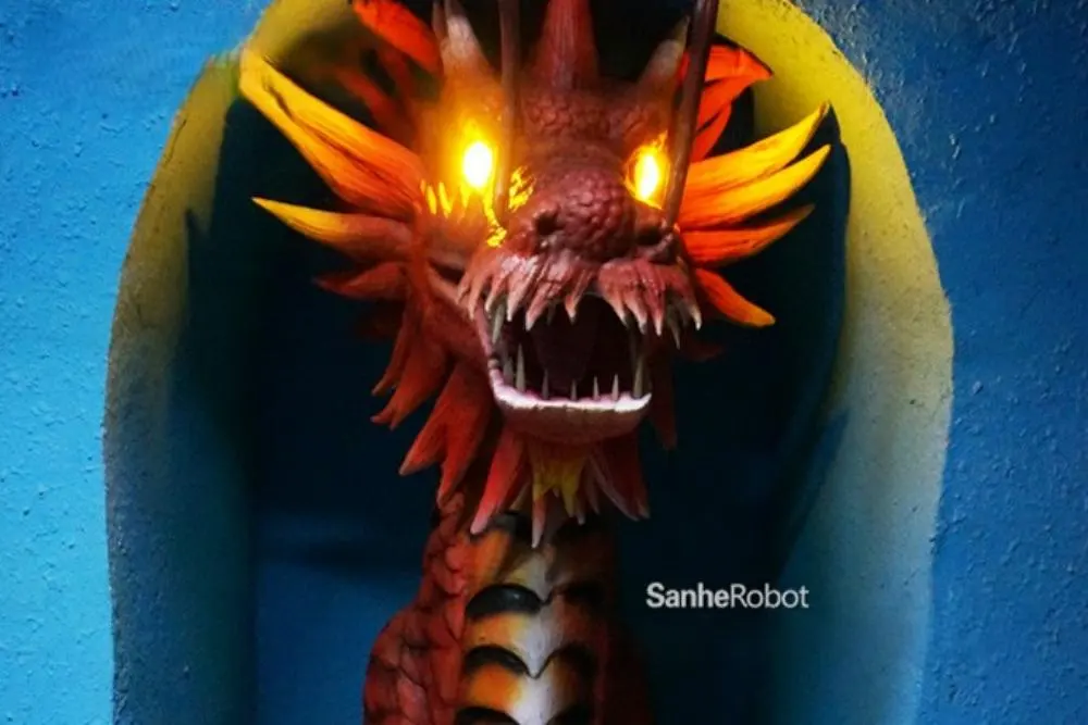 Animatronic dragon with warm LED eyes for mythical cave experience