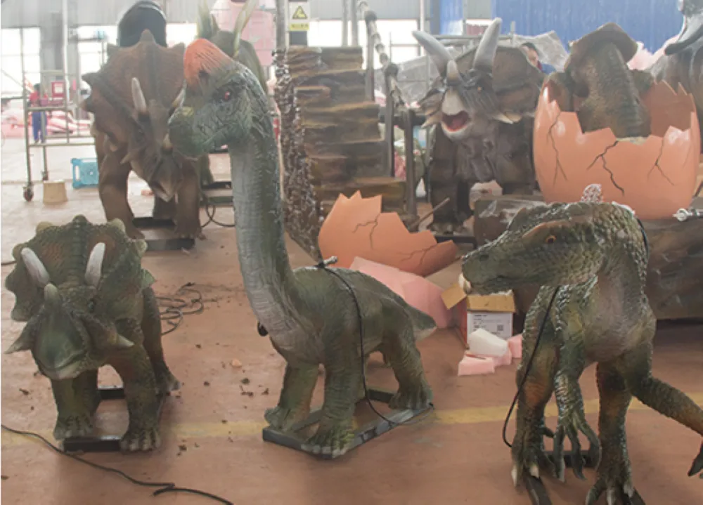 1.2m compact animatronic dinosaur models with control box and accessories in manufacturing facility
