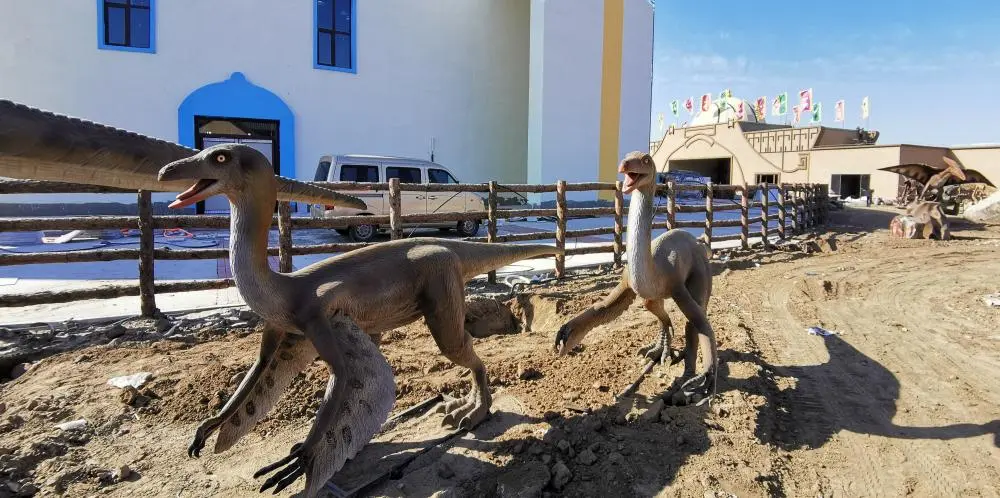 Animatronic Ornithomimus dinosaurs in theme park - fast running ostrich-mimic dinosaur exhibition
